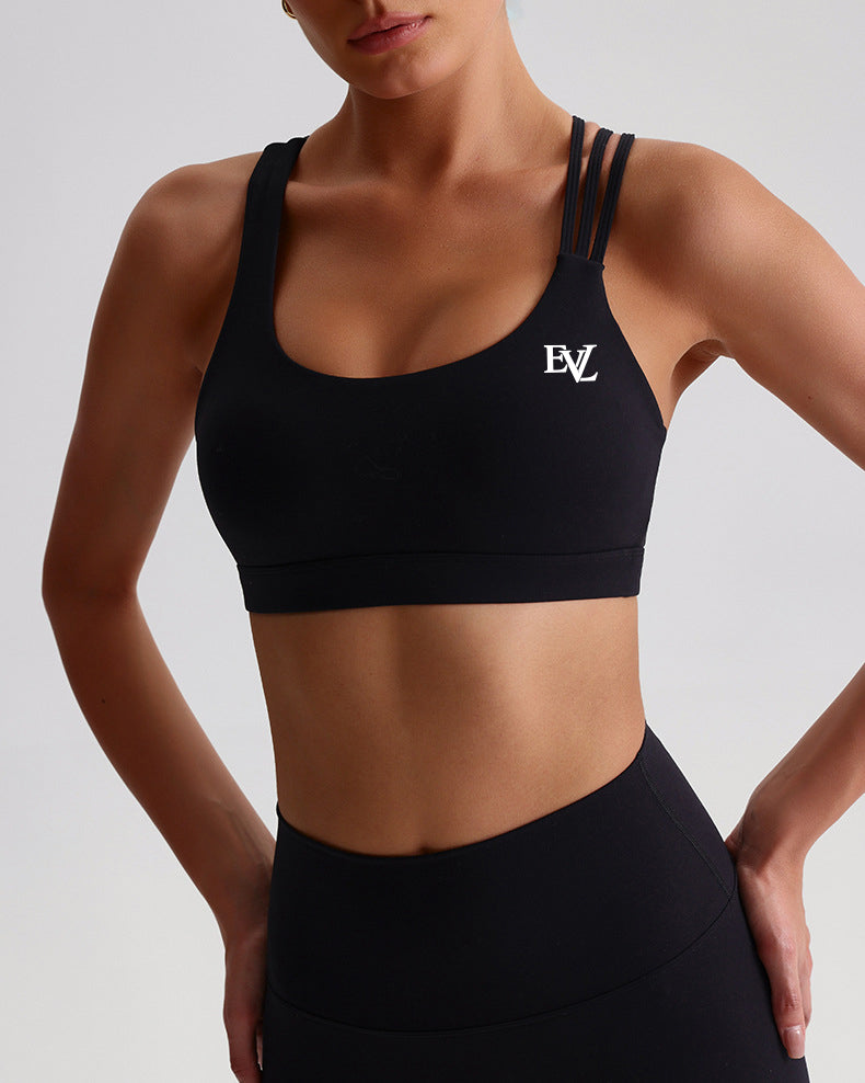 Black EVL sports bra with a scoop neckline and contrasting chest logo.