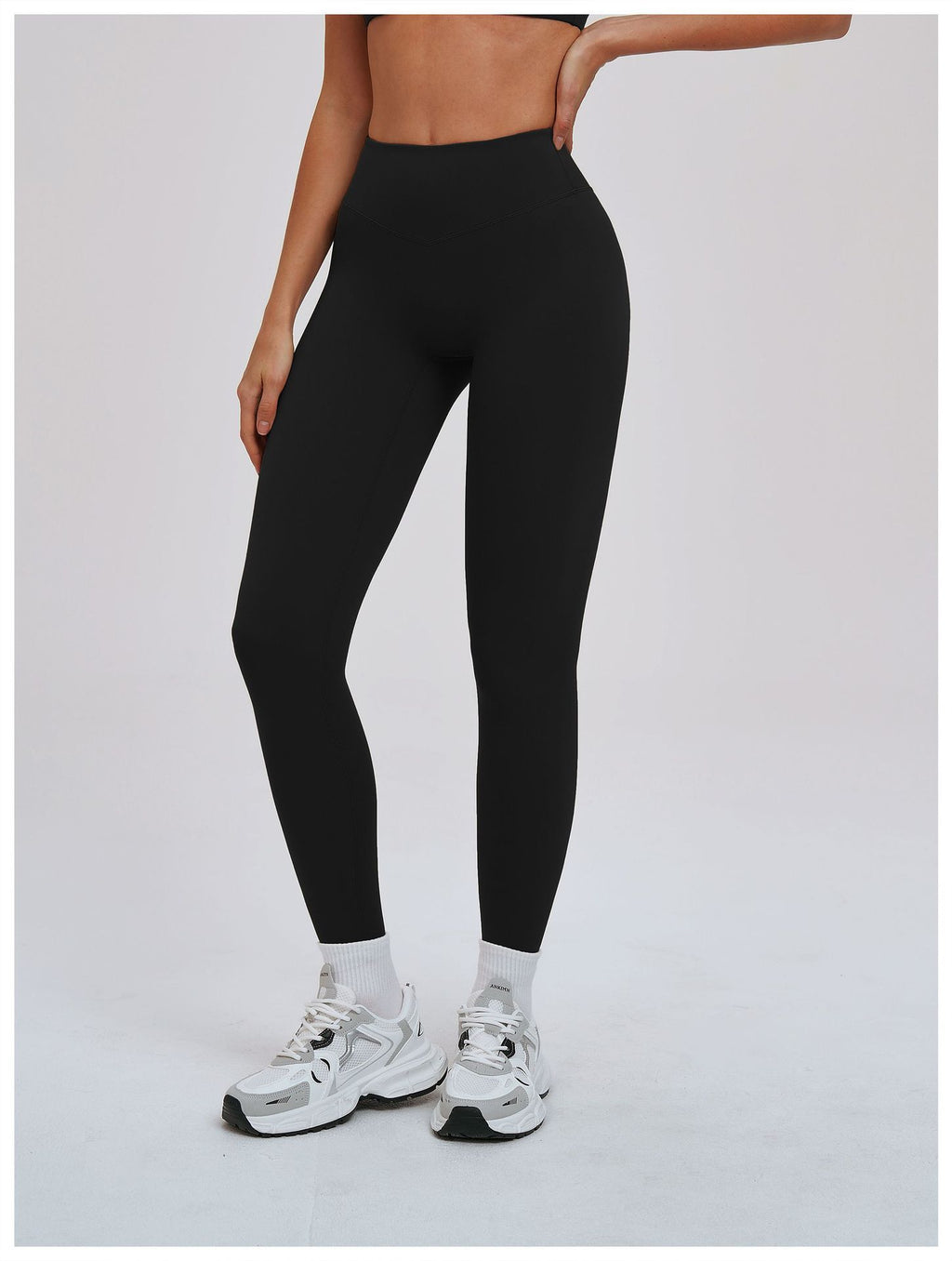 Black EVL leggings in a minimalist activewear style.