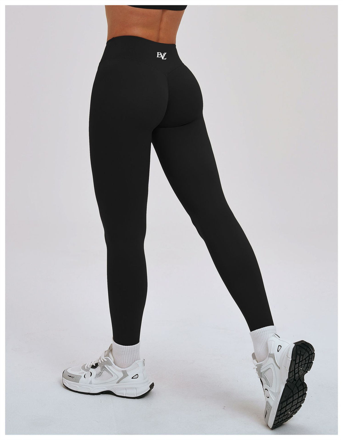 Additional product view of EVL leggings in black.