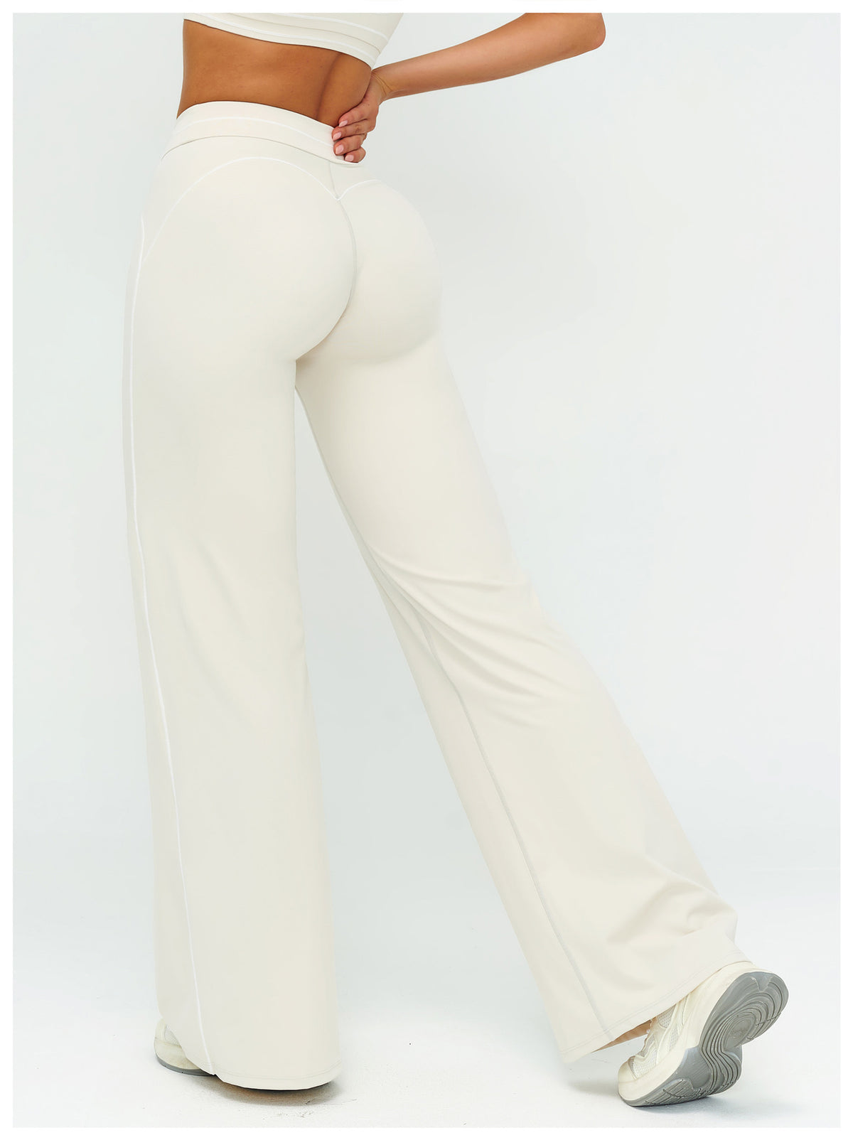 Additional view of cream EVL flared leggings.