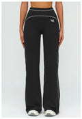 Black EVL leggings with a distinctive flared-leg silhouette.