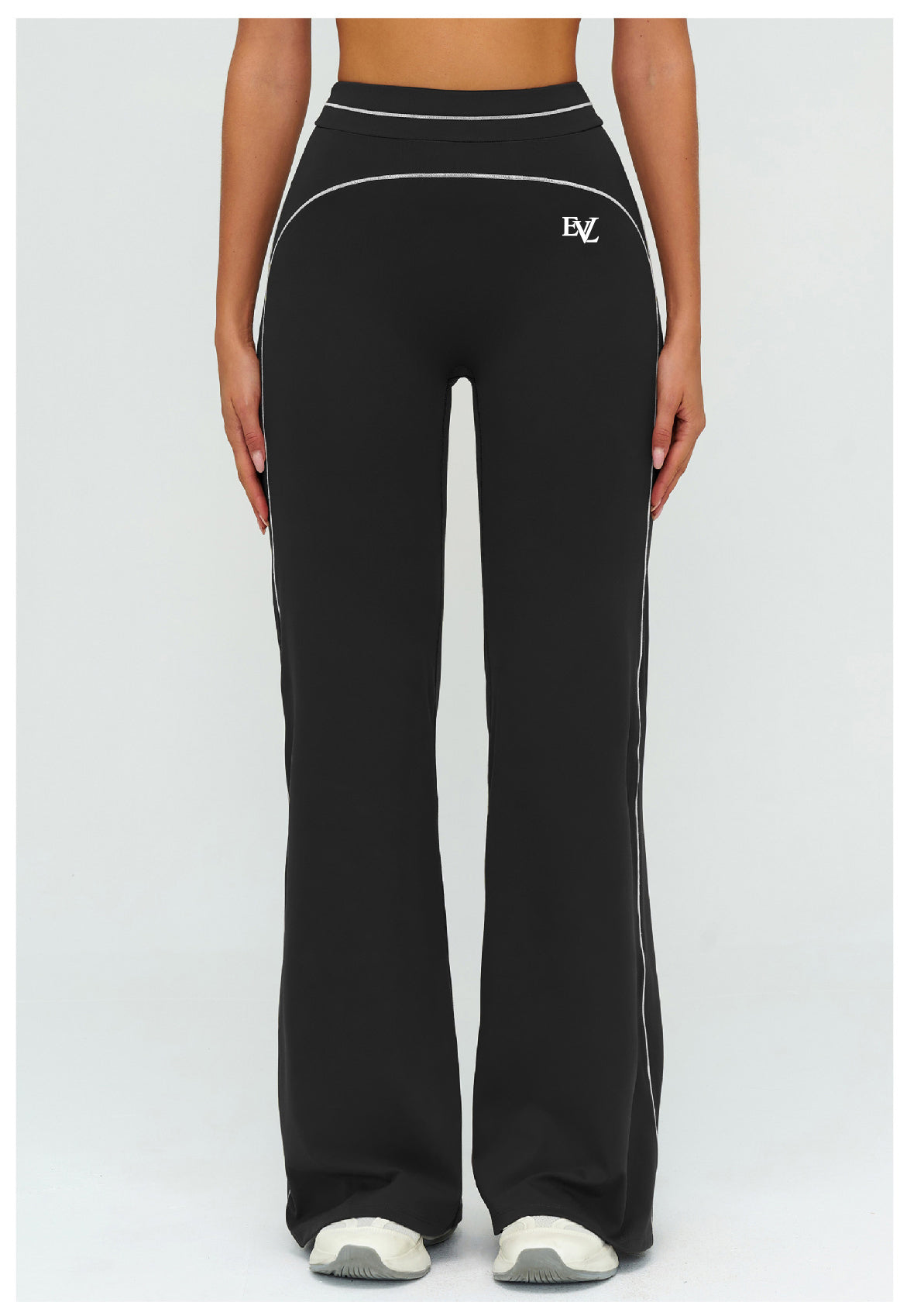 Black EVL leggings with a distinctive flared-leg silhouette.