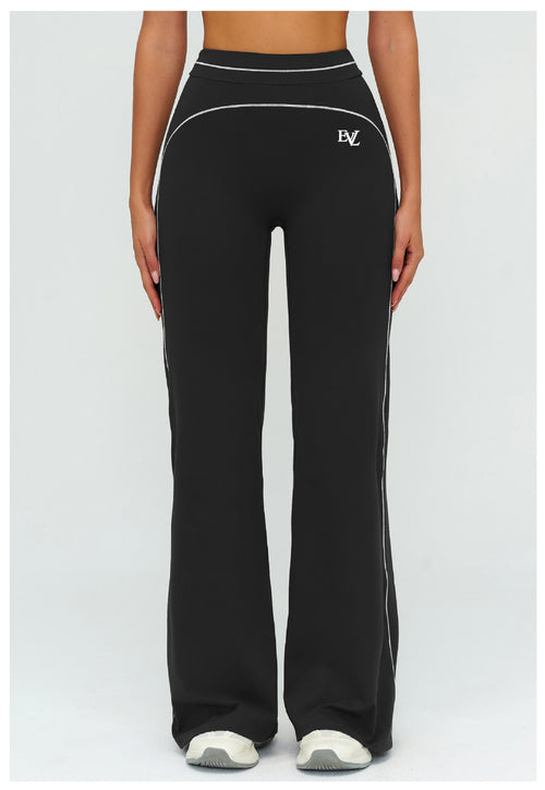 Black EVL leggings with a distinctive flared-leg silhouette.