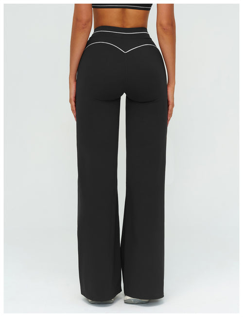 Additional view of black EVL flared leggings.