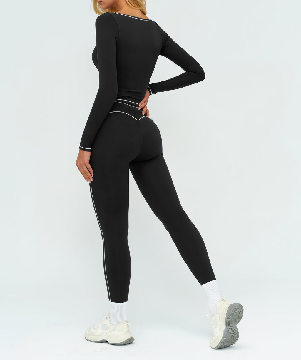 Additional product view of the black EVL long-sleeve top.