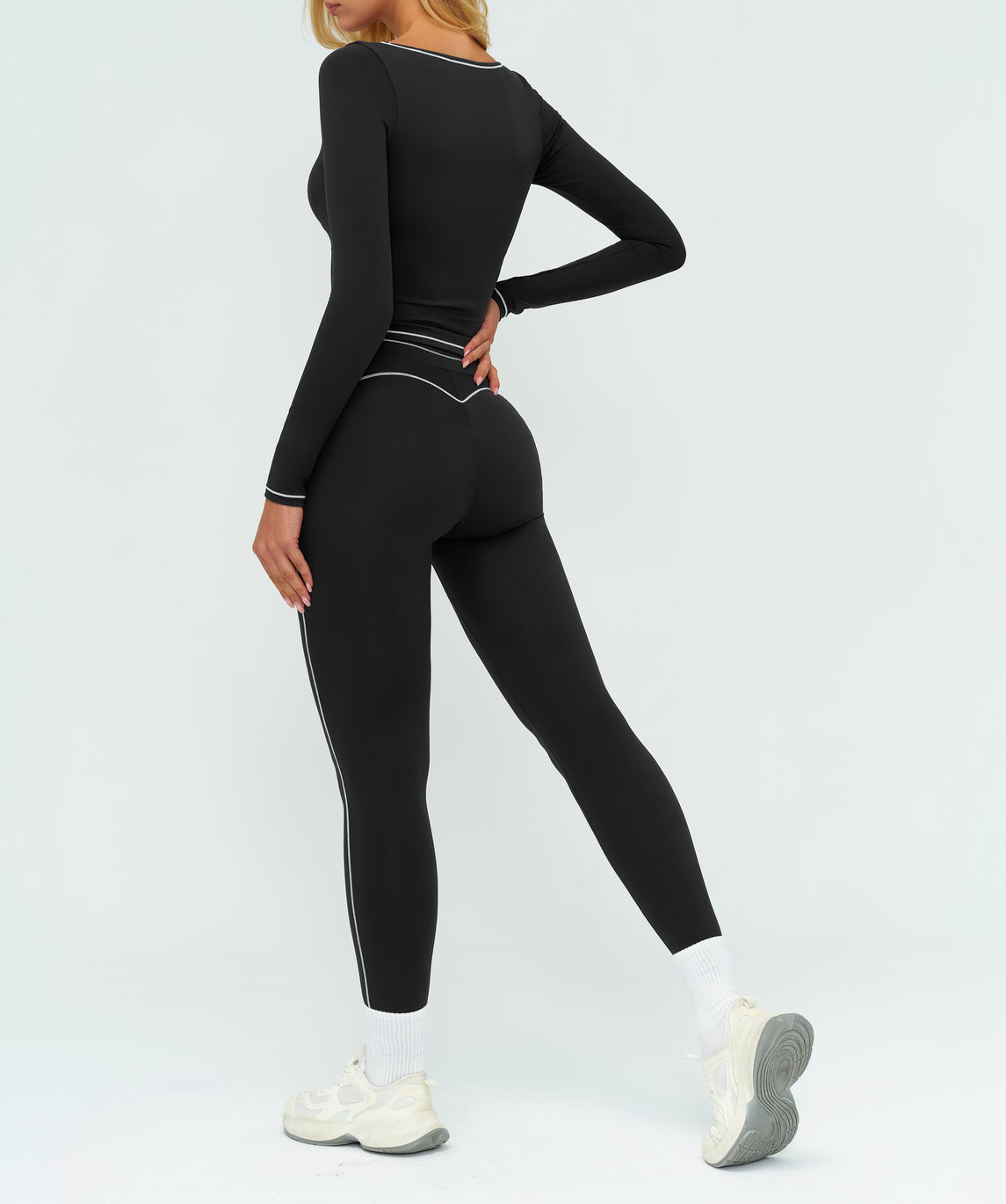 Additional product view of the black EVL long-sleeve top.