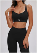 Black EVL sports bra with a scoop neckline and wide underband.