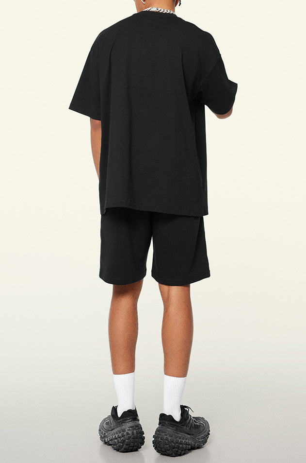 Additional view of the black EVL T-shirt and shorts set.