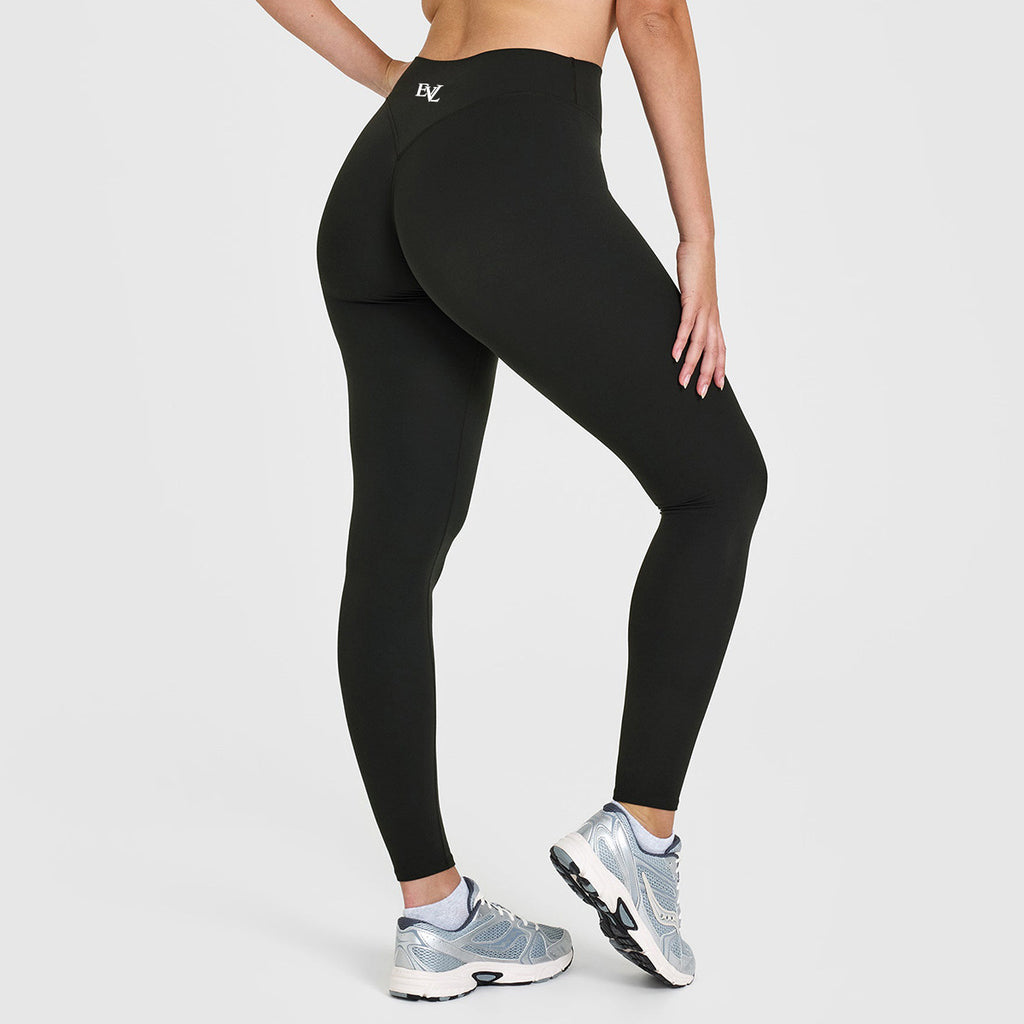 Additional view of black EVL scrunch leggings with an ankle-length cut.