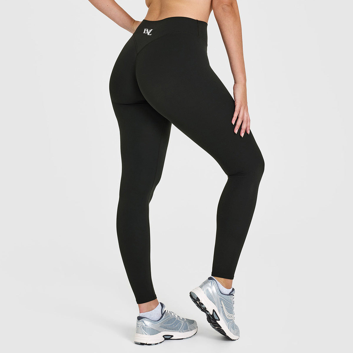 Additional view of black EVL scrunch leggings with an ankle-length cut.